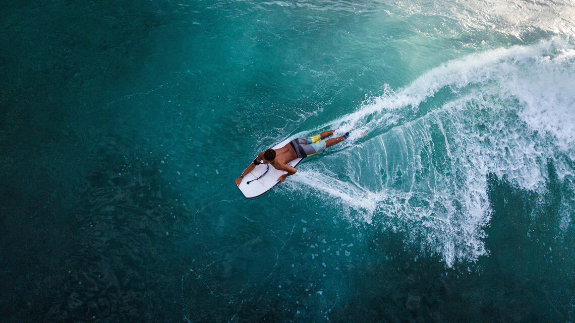 Bodyboard: as a general rule of thumb, the board should reach up to about your belly button when stood on the floor | Photo: Shutterstock