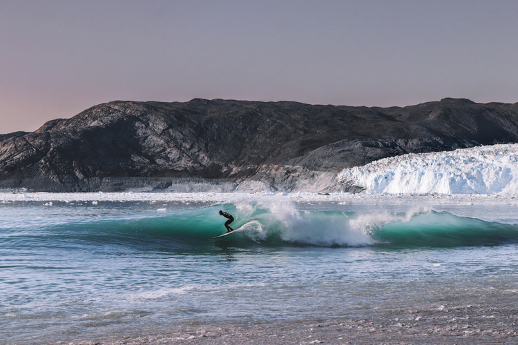 Eurico Romaguera: riding a wave triggered by a glacier calving event in Greenland | Photo: Jorge Abian