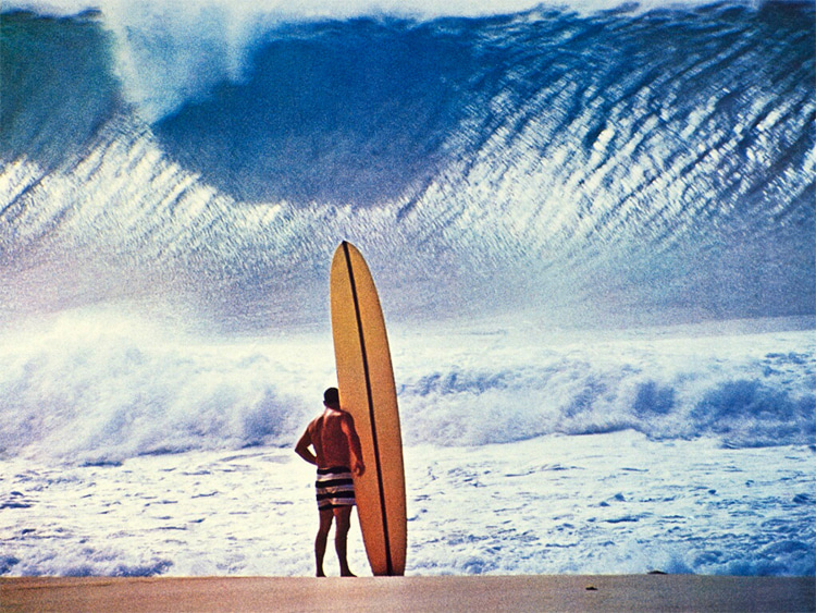 Greg Noll: wearing his trademark black-and-white, prison-stripe trunks at Banzai Pipeline | Photo: John Severson