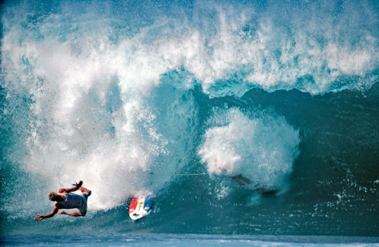 Joey Buran: this disastrous wipeout with New Zealander Allen Byrne happened in the 1981 Pipeline Masters semifinals. The waves that day were terrifying and treacherous! It was also my first wave of the day. Not surprisingly, I never recovered, failing to qualify for the final. I woke up that morning sure that I would win, but my day turned into a nightmare and a loss that humbled me more than any other | Photo: Brian Beilmann