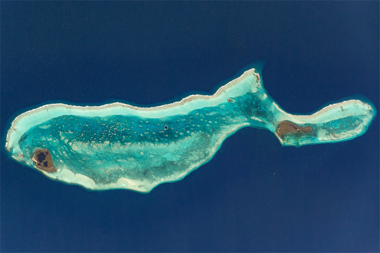 Lighthouse Reef, Belize: notice the Great Blue Hole in the center of the coral formation | Photo: NASA