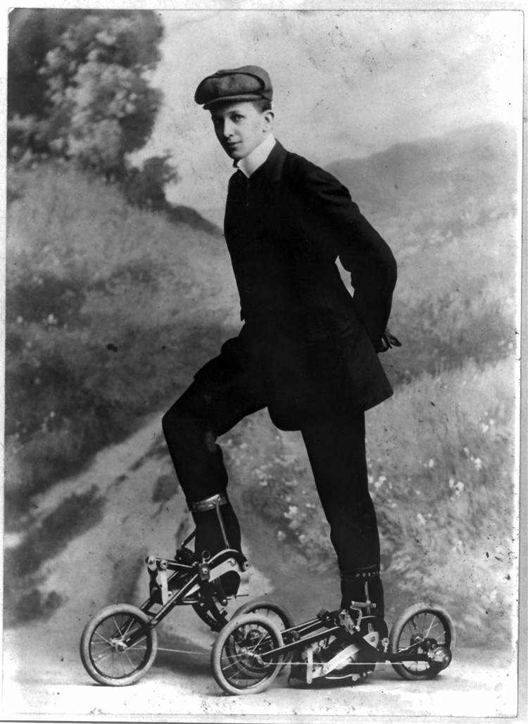 Roller skating, 1910: a young man stands on miniature, two-wheeled bicycle-like roller skates | Photo: Library of Congress