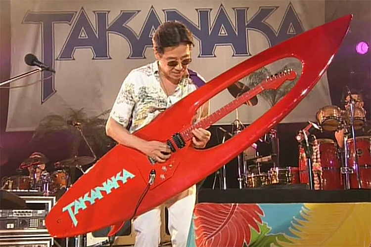 Masayoshi Takanaka: his custom-made red surfboard-shaped guitar weighs 13 pounds